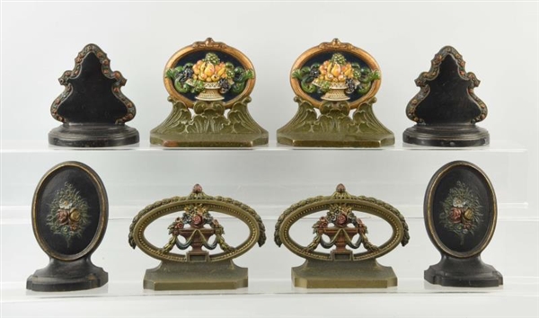 LOT OF 4: PAIRS OF CAST IRON FLOWER BOOKENDS.     