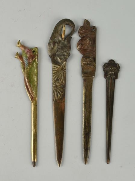 LOT OF 4: CAST IRON ASSORTED LETTER OPENERS.      