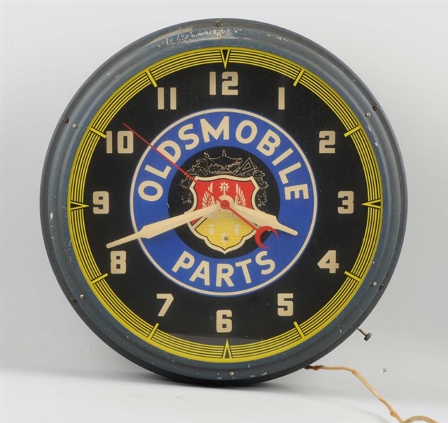 1940-50’S OLDSMOBILE PARTS WITH LOGO NEON CLOCK.  