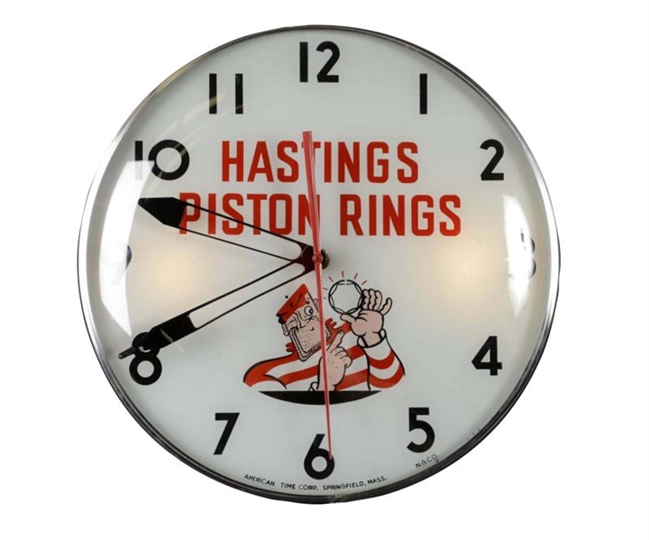 1950’S HASTINGS PISTON RINGS WITH LOGO CLOCK.     