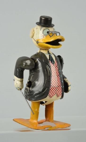 JAPANESE LINEMAR TIN WIND UP UNCLE SCROOGE TOY.   