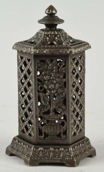 CAST IRON FLORAL SPACEHEATER STILL BANK.          