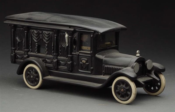 CONTEMPORARY CAST IRON HEARSE TOY.                