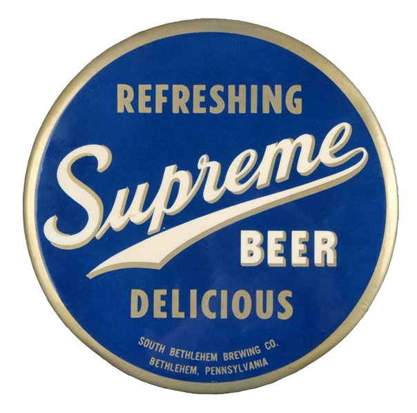 SUPREME BEER TIN OVER CARDBOARD BUTTON SIGN.      