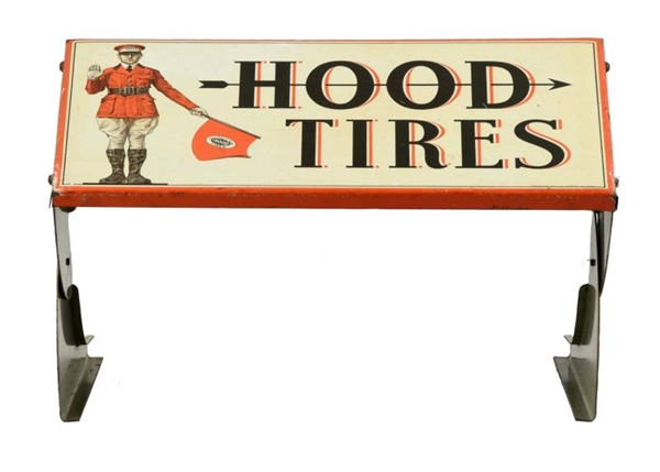 HOOD TIRES WITH MAN TIRE STAND.                   