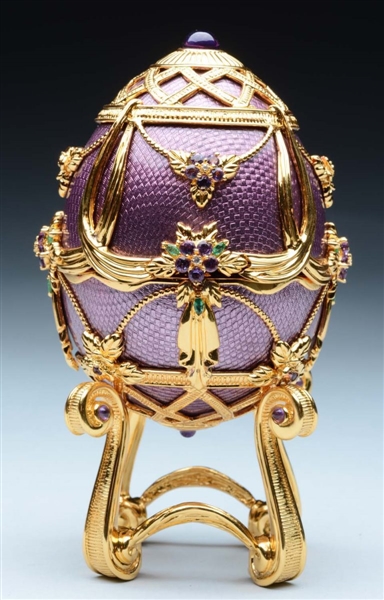 FABERGE EGG WITH JEWELS ON STAND.                 