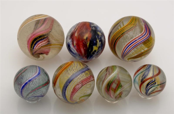 LOT OF 7: LARGE HANDMADE MARBLES.                 