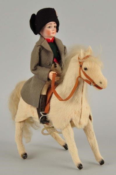 MAN AND HORSE MECHANICAL TOY.                     