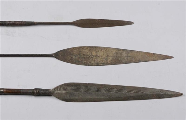 LOT OF 3: UNKNOWN SPEARS ON WOOD SHAFTS.          