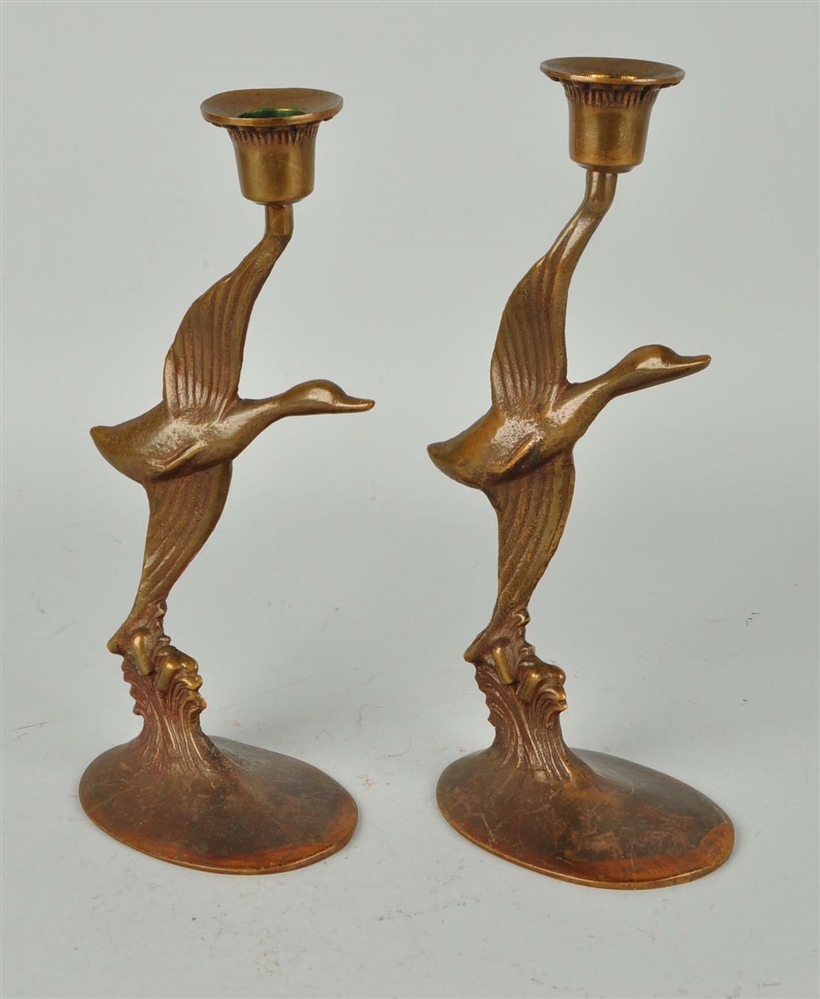 ONE PAIR CAST BRONZE FLYING GOOSE CANDLE HOLDERS.