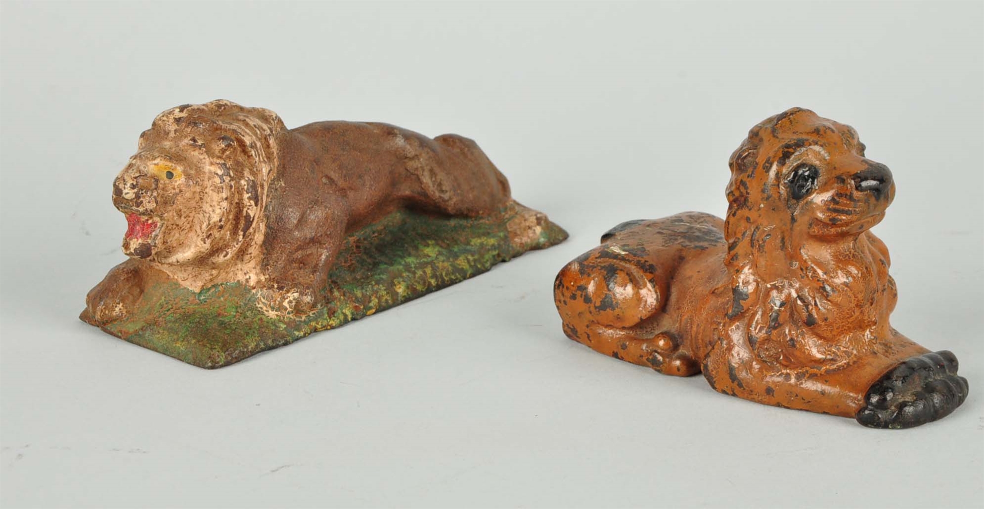 LOT OF 2: CAST IRON LION PAPERWEIGHTS.