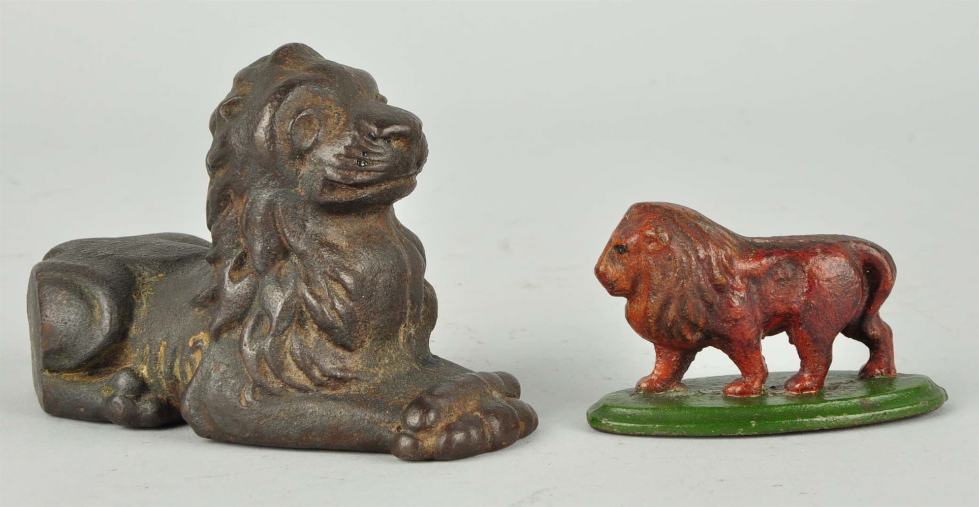 LOT OF 2: CAST IRON LION PAPERWEIGHTS.