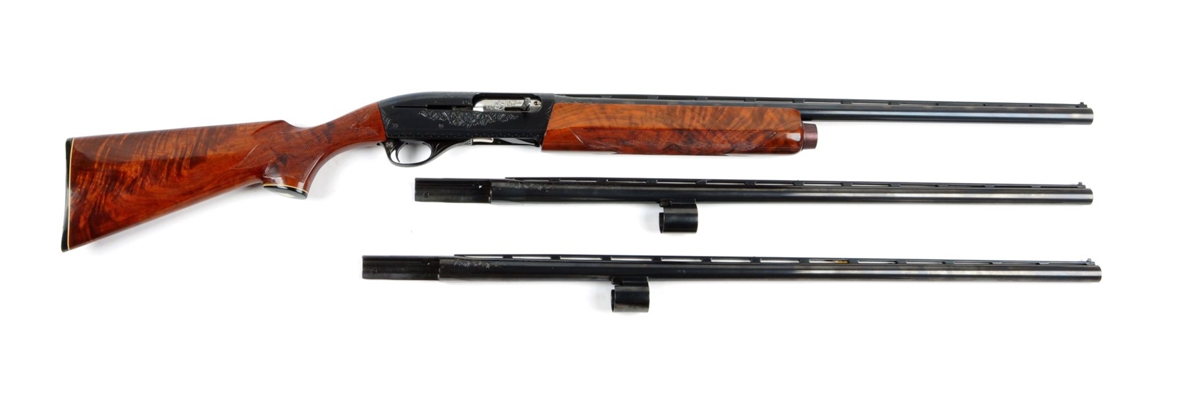 (M) REMINGTON MODEL 1100-D CUSTOM GRADE SHOTGUN.  