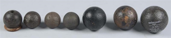 LOT OF 7:  EXCAVATED CANNON BALLS.                