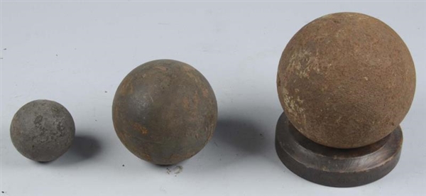 LOT OF 3: EXCAVATED CANNON BALLS.                 