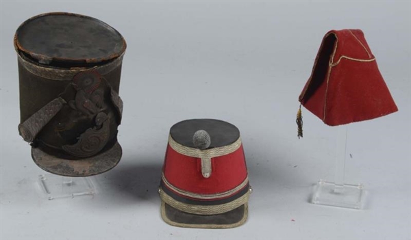 LOT OF 3:  SHAKOS & OTHER MILITARY CAP.           