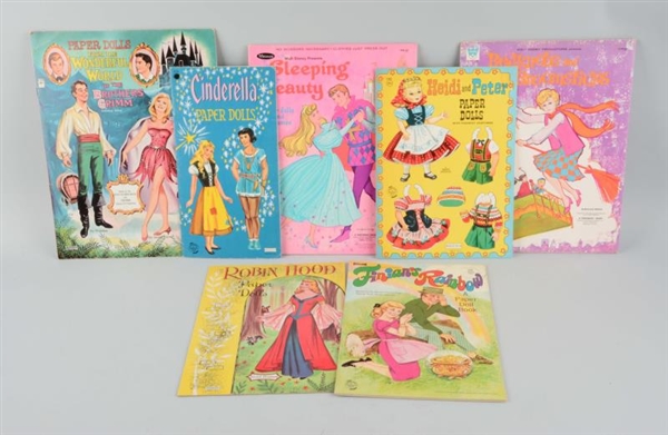 LOT OF 7: ASSORTED VINTAGE UNCUT PAPER DOLL BOOKS.