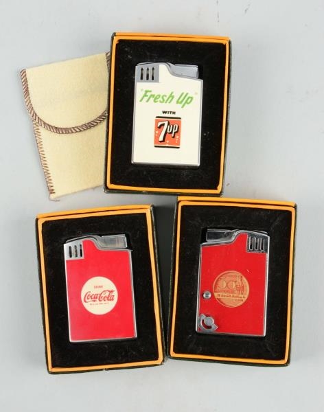 LOT OF 3: COCA-COLA & 7 UP MUSICAL LIGHTERS.      