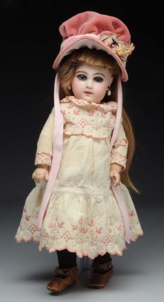 FRENCH JUMEAU DOLL IN PINK HAT.                   