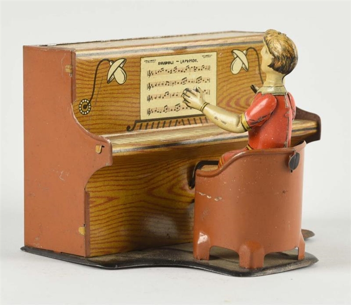UNUSUAL GERMAN TIN LITHO PIANO PLAYER TOY.        