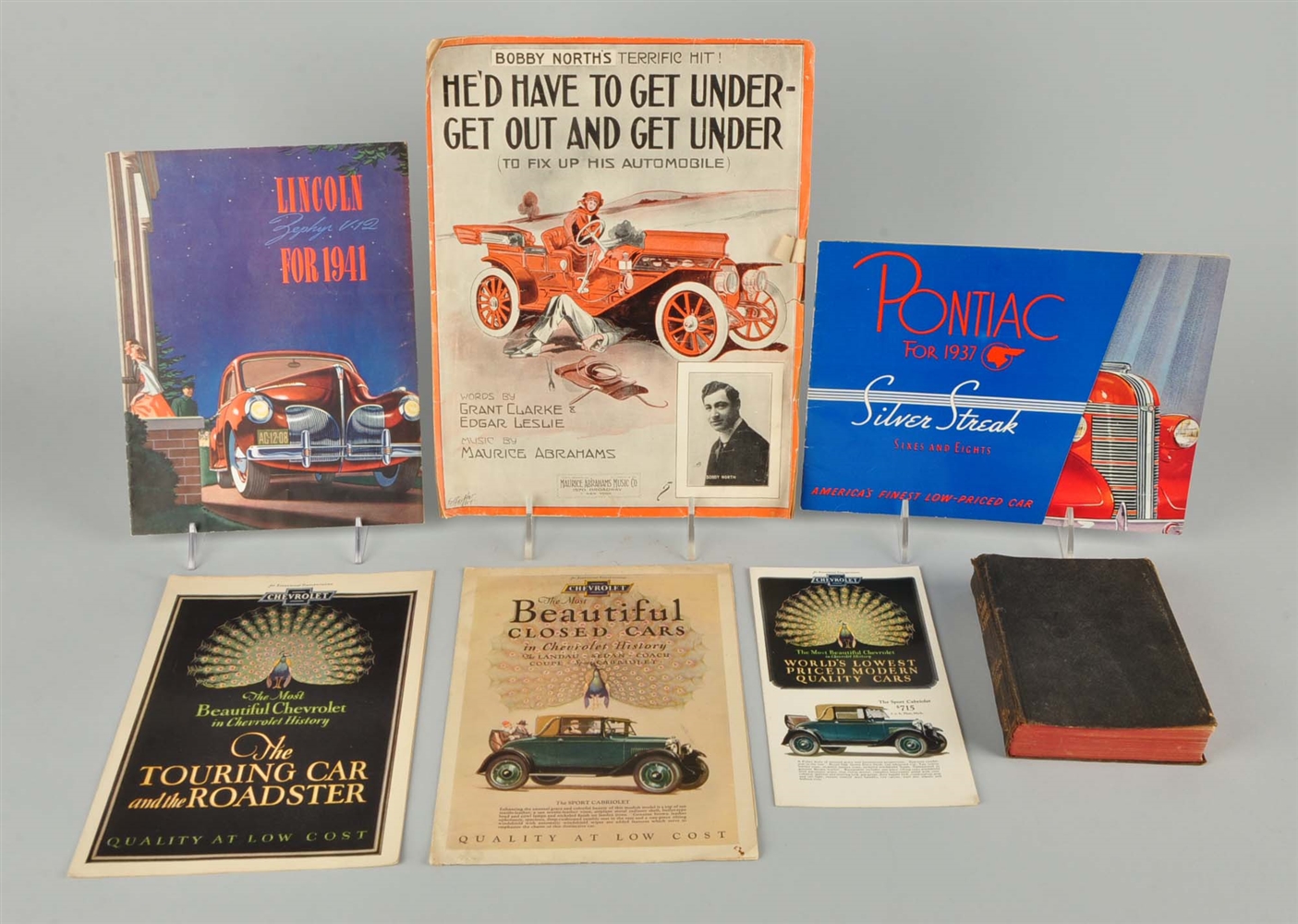 LOT OF 7: AUTOMOBILE ADVERTISING PAMPHLETS & TEXT.