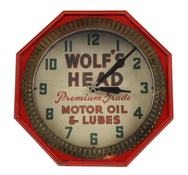 WOLFS HEAD MOTOR OIL & LUBES OCTAGON NEON SPINNER CLOCK.                                      
