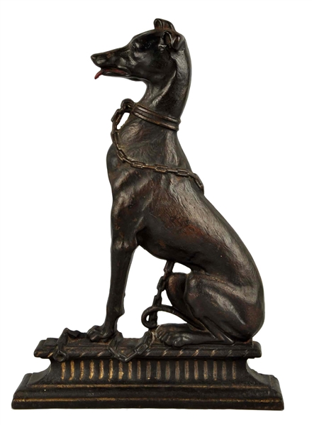 CAST IRON SITTING GREYHOUND DOG DOORSTOP.         