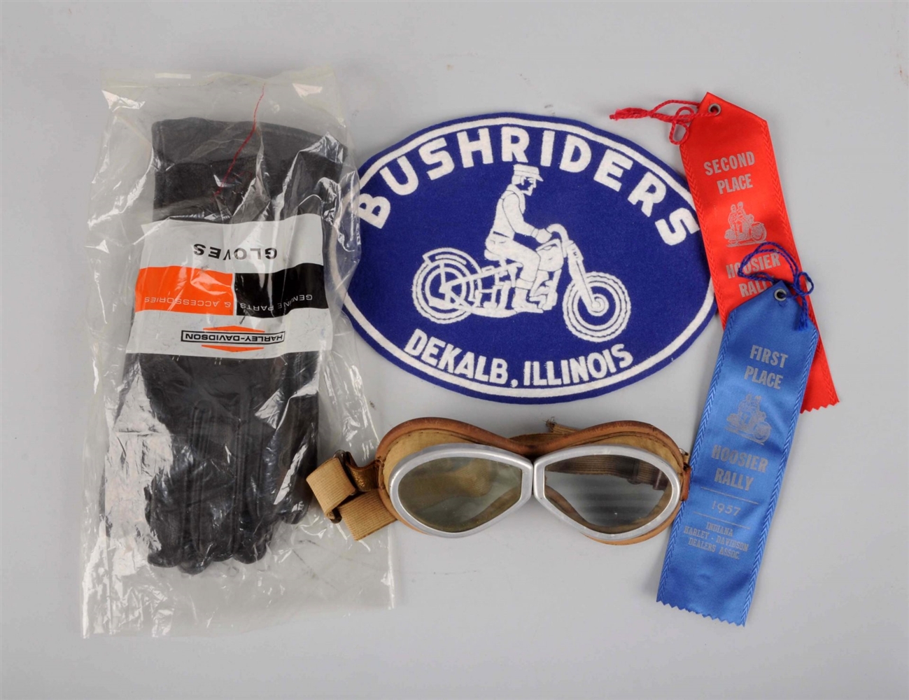 LOT OF 5: HARLEY GLOVES, GOGGLES & RIBBONS.