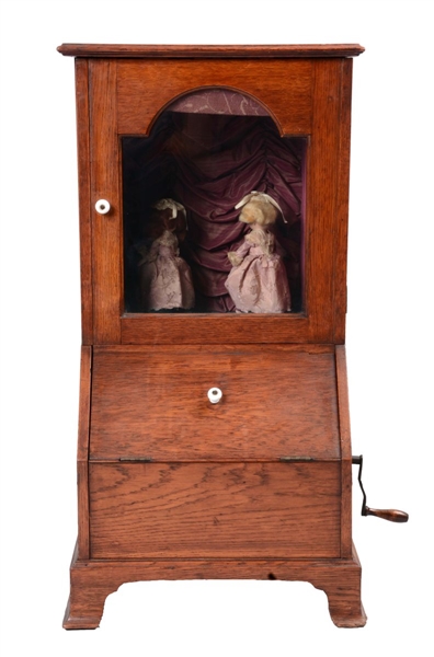 AUTOMATON OF TWO DANCING DOLLS OAK CABINET.       