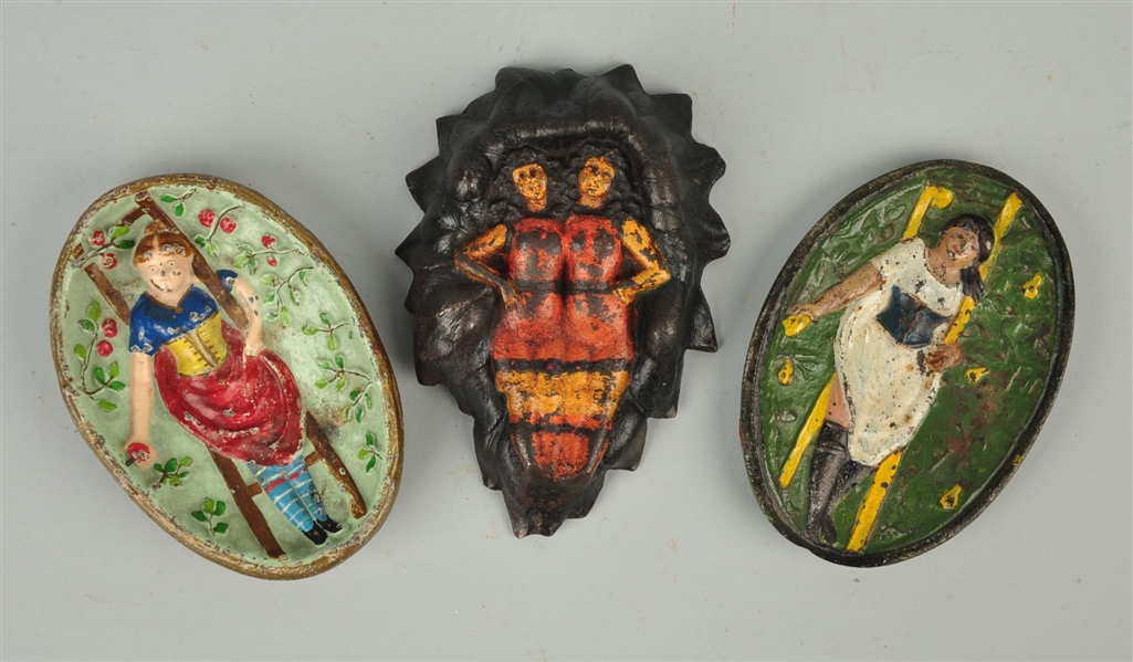 LOT OF 3: CAST IRON ASSORTED NAUGHTY TIP TRAYS.