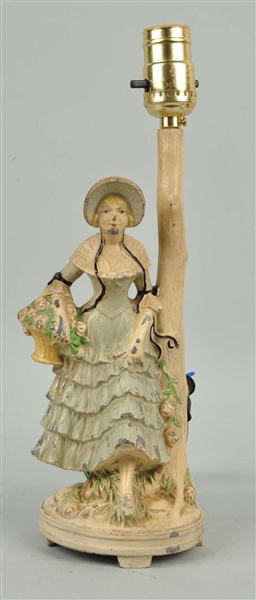 CAST WHITE METAL LADY IN HOOPED SKIRT LAMP.