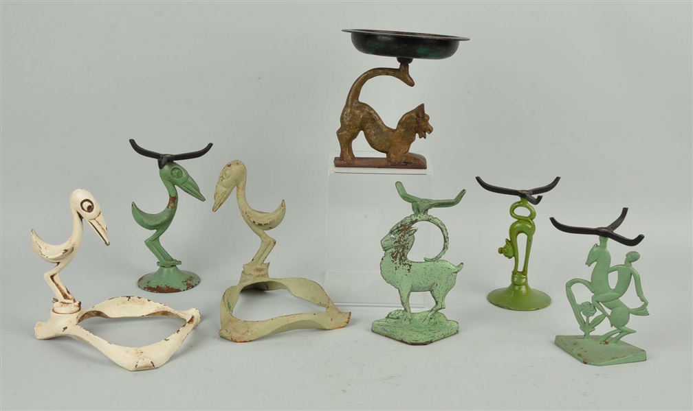 LOT OF 7: CAST IRON ASSORTED DECO STANDS.