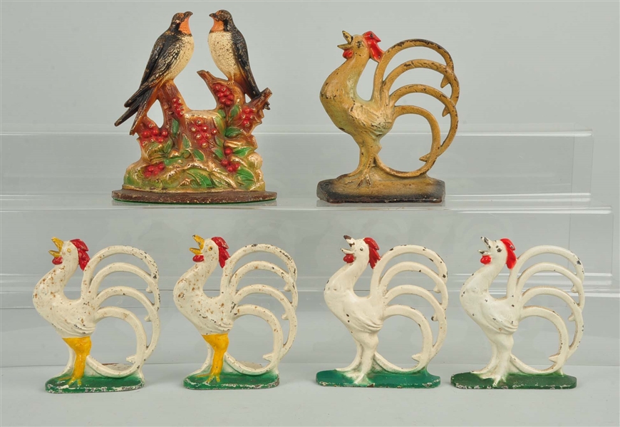 LOT OF 1 PAIR, 4 SINGLES: CAST IRON ASSORTED ROOSTER BOOKENDS & DOORSTOPS.