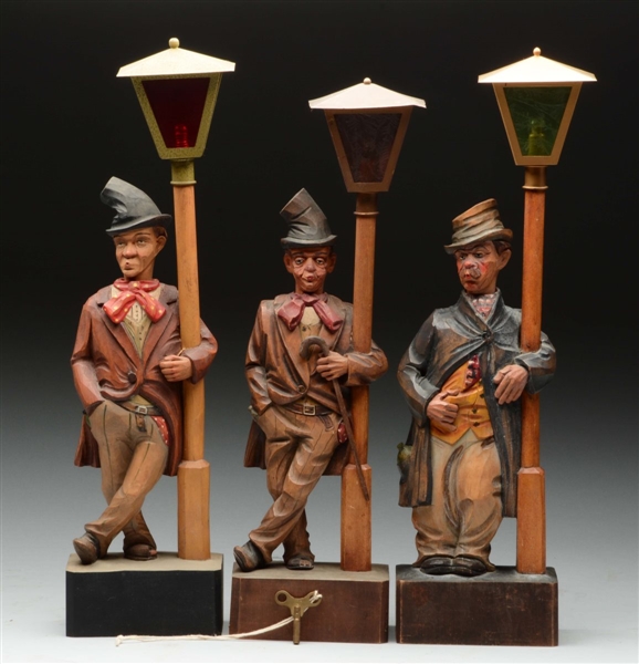 LOT OF 3: CARVED WOOD BUM ON LAMP POST WHISTLERS. 