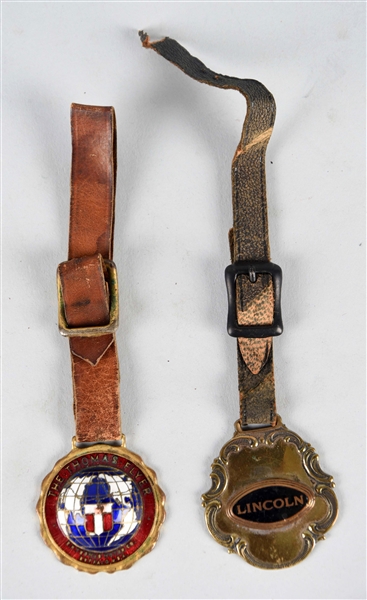 LOT OF 2: ORIGINAL LINCOLN & THOMAS FLYER WATCH FOBS.                                                  