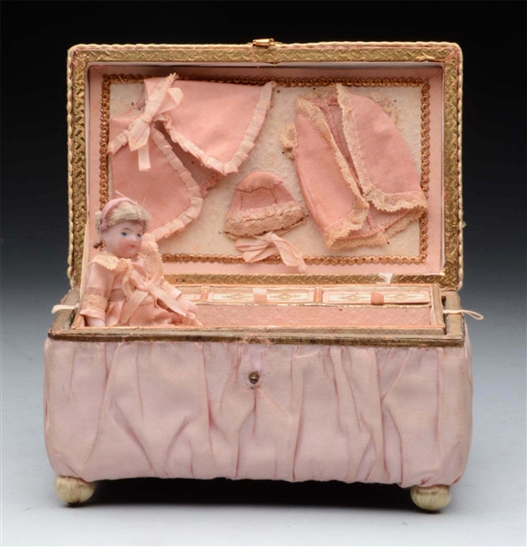 PINK SATIN BOX W/ ALL-BISQUE DOLL.                