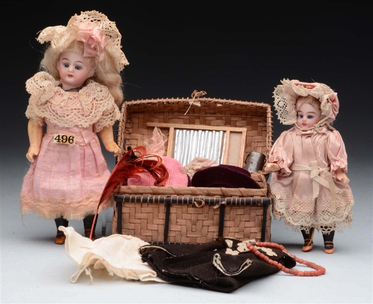 LOT OF 2: SMALL DOLLS & TRUNK.                    