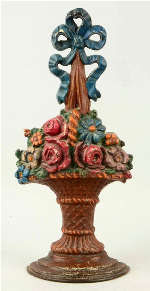 CAST IRON MIXED FLOWERS IN WICKER BASKET WITH BOW DOORSTOP.