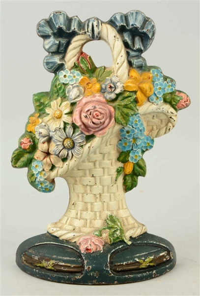 CAST IRON MIXED FLOWERS IN FRENCH BASKET DOORSTOP.