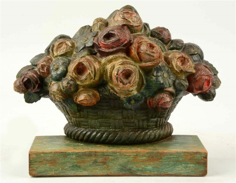 CAST IRON BOUQUET OF ROSES IN BASKET.