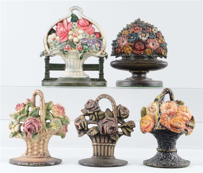 LOT OF 5: CAST IRON ASSORTED FLOWER BOOKENDS.