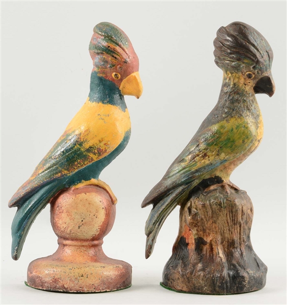 LOT OF 2: CAST IRON ASSORTED COCKATIEL DOORSTOPS.