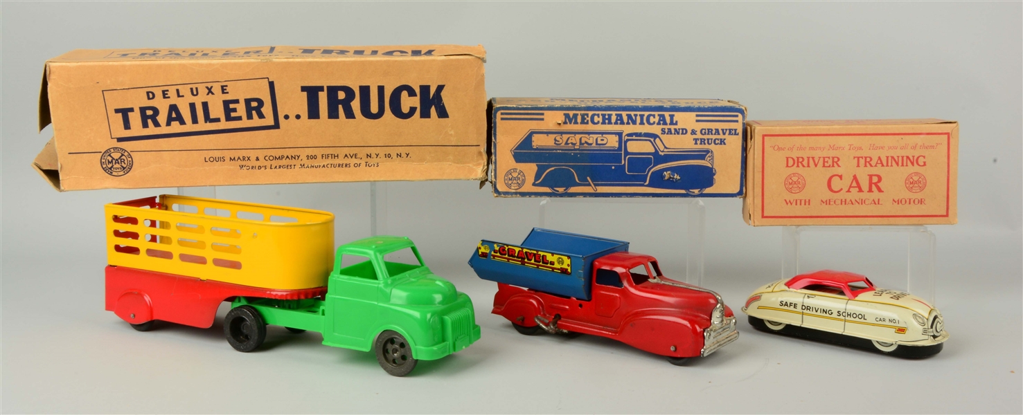 LOT OF 3: TIN TRUCKS IN BOXES.