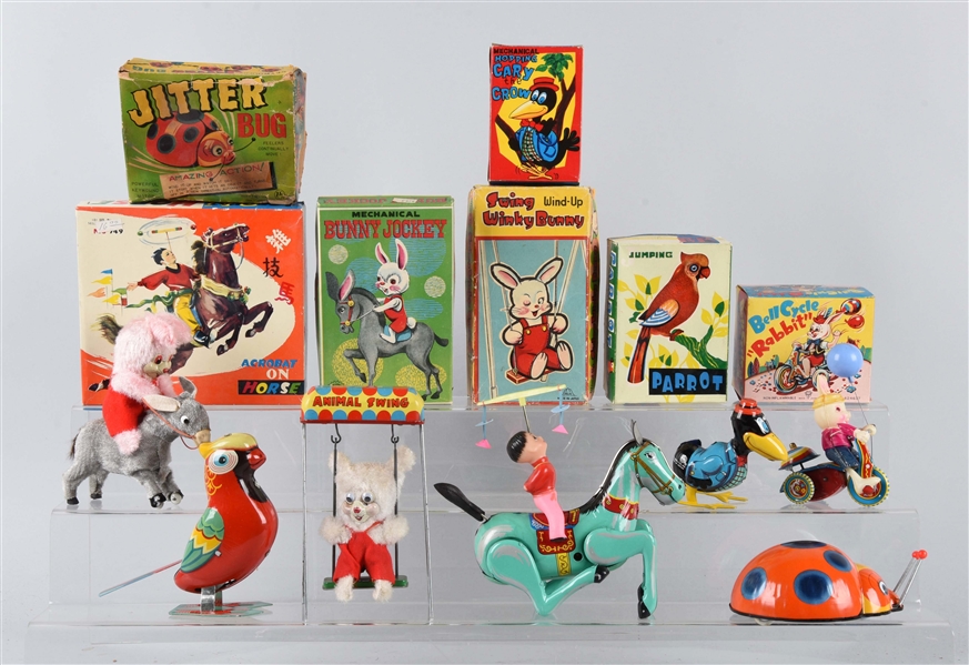 LOT OF 7: TIN WIND-UP TOYS.