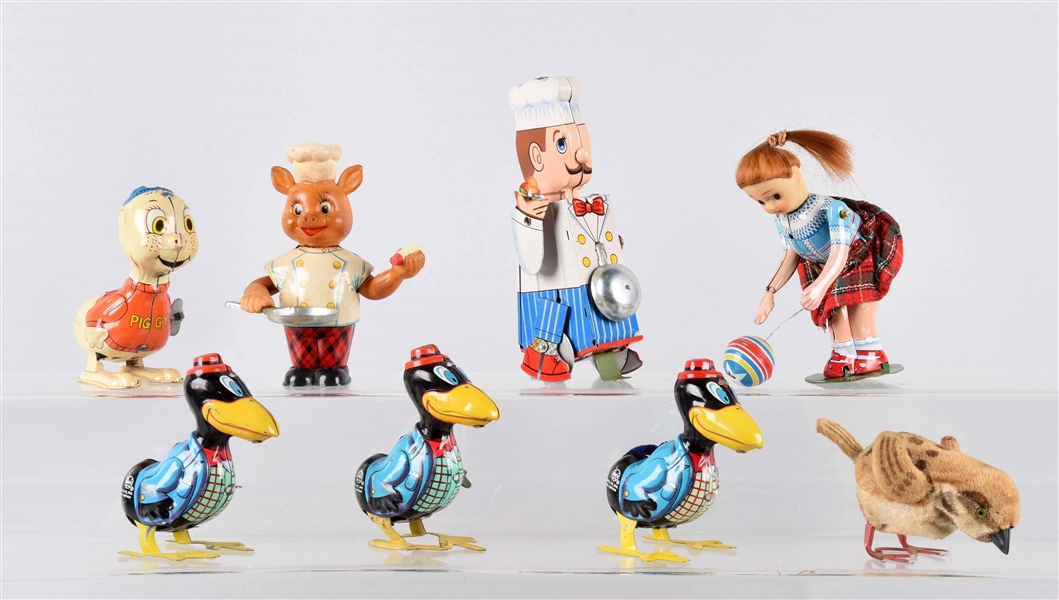 LOT OF 8: WIND-UP TOYS.