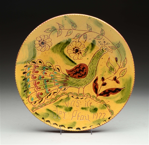 BREININGER REDWARE POTTERY PLATE W/ PEACOCK.