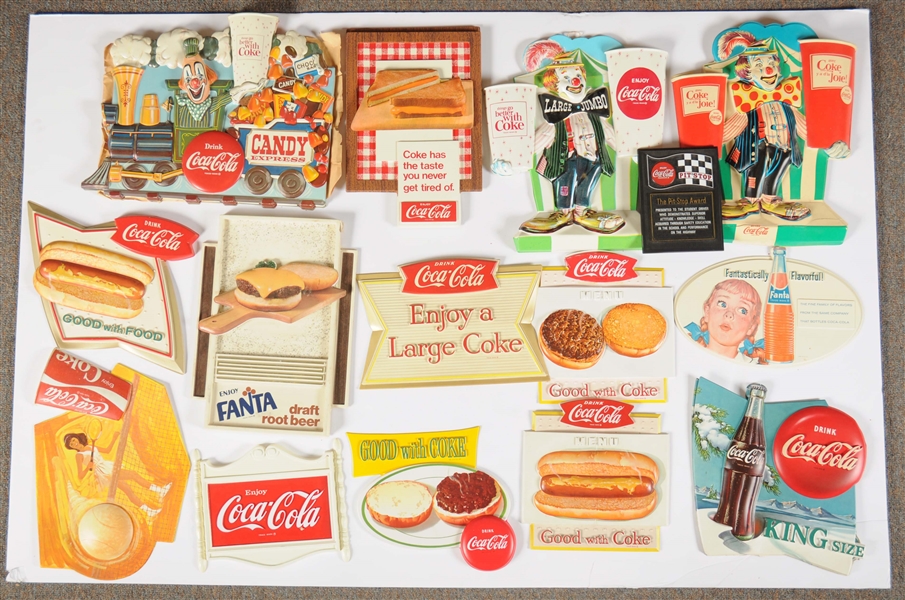 LARGE LOT OF PLASTIC COCA - COLA ADVERTISING SIGNS.