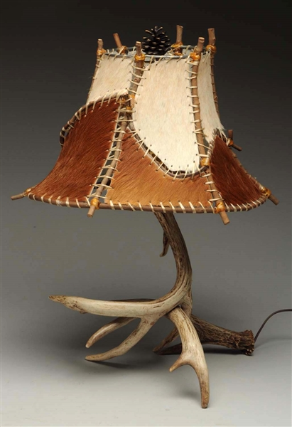 HORN LAMP WITH RAW HIDE SHADE.     