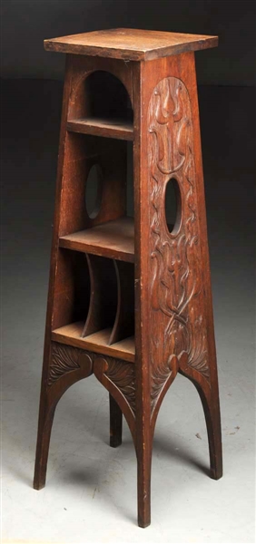 ARTS & CRAFTS CARVED MAGAZINE STAND W/ CUTOUTS.