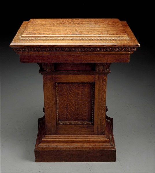 CARVED PODIUM W/ CORBELS UNDER THE TOP.